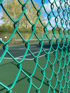 Rankins landing tennis court through fence